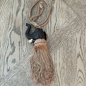 Vintage leather trunk up elephant tassel
